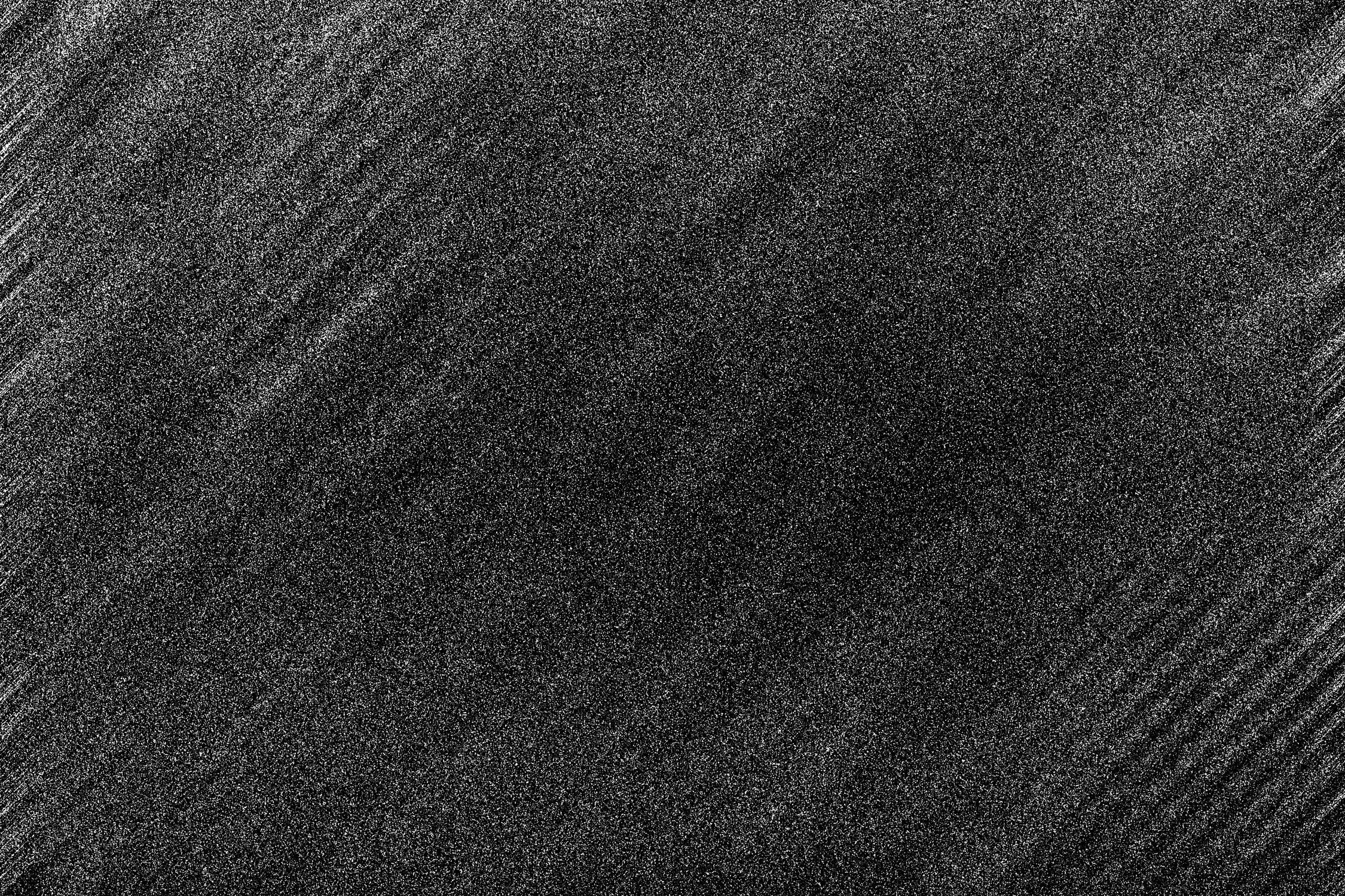 An abstract black and white grainy grunge texture background ima